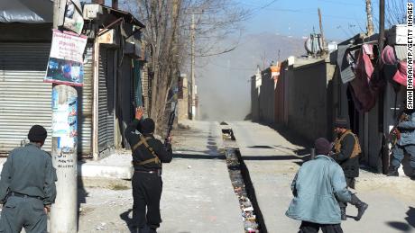 Afghan policemen in Kabul after the attack on Thursday. 