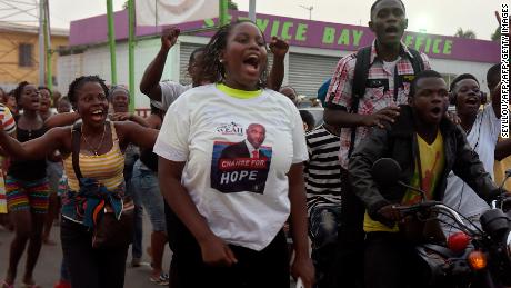 Weah supporters react after the announcement of partial results of the second round of the presidential election, on December 28, 2017 in Monrovia, the Liberian capital.