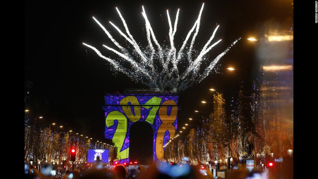 Lights and fireworks are seen at the Arc de Triomphe on the Champs-Élysées in Paris.