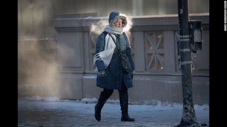 A woman in Chicago walks to work in sub-zero temperatures on Tuesday, January 2. Blasts of Arctic air have brought weather-related deaths, record-low temperatures and historic amounts of snowfall to parts of the United States.