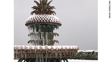 A metal pineapple tops a fountain in Charleston.