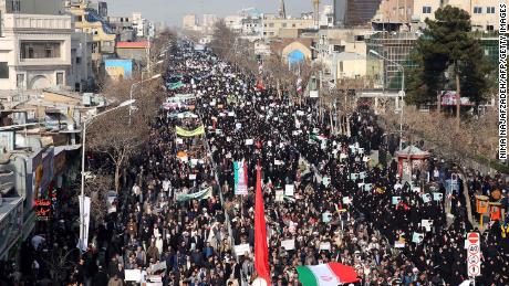 Iranian pro-government supporters march in the city of Mashhad on Thursday.