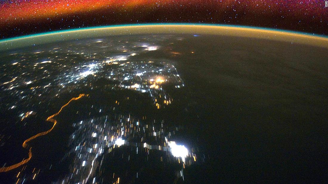 Bright swaths of red in the upper atmosphere, known as airglow, can be seen in this image from the International Space Station. NASA's ICON mission will observe how interactions between terrestrial weather and a layer of charged particles called the ionosphere create the colorful glow.