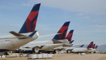 Delta Air Lines Boeing 747-400s sit in the desert awaiting their fate after being retired from the airline&#39;s fleet.