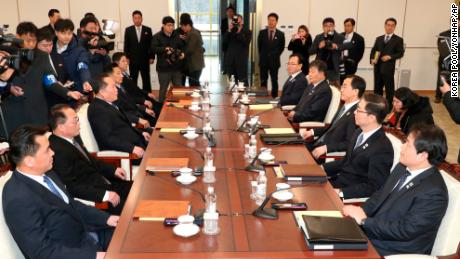 South Korean Unification Minister Cho Myoung-gyon, third from right, and the head of a North Korean delegation Ri Son Gwon, third from left, with their respective delegations.