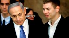 A picture taken on March 18, 2015 shows Israeli Prime Minister Benjamin Netanyahu (L) and his son Yair visiting the Wailing Wall in Jerusalem.
The son of Israeli Prime Minister Benjamin Netanyahu faced online criticism on September 9, 2017 after sharing an image on his Facebook page deemed anti-Semitic by critics. 