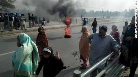 People burn tyres during a protest in Kasur on Wednesday against the murder and rape of Zainab.