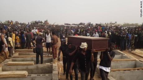 Men carrying coffin during the mass burial in Makurdi, Benue on Thursday