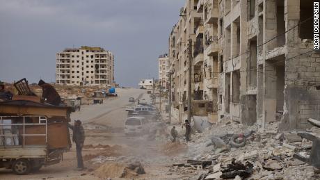 After the horror of airstrikes, families lucky enough to have survived salvage what they can from the wreckage. Nearly 60 people lost their lives in this airstrike in the center of Idlib, Syria.