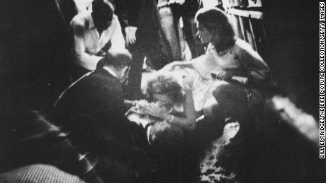 Robert F. Kennedy lies wounded on the floor of the Ambassador Hotel&#39;s kitchen while his wife Ethel leans over him on June 5, 1968, in Los Angeles.