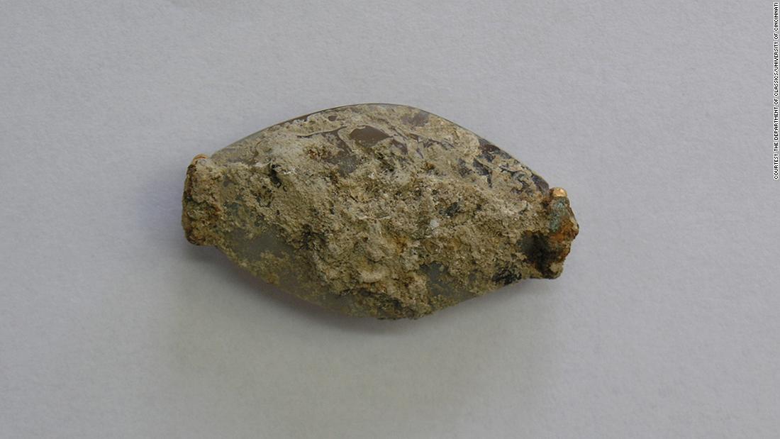 The sealstone was covered in limestone when it was first discovered. Measuring just 1.4 inches in length, it was initially mistaken for a bead.