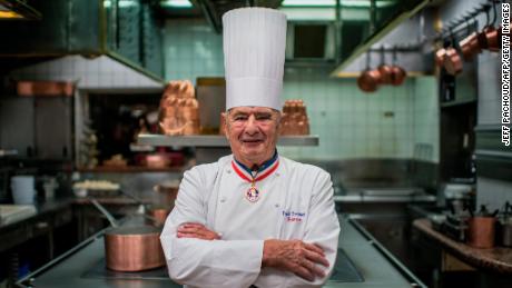 Paul Bocuse poses in the kitchen of his restaurant, l&#39;Auberge du Pont de Collonges, near Lyon, in 2012.