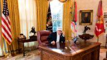 President Donald J. Trump talks on the phone in the Oval Office receiving the latest updates from Capitol Hill on negotiations to end the Democrats government shutdown, Saturday, January 20, 2018, at the White House in Washington, D.C.