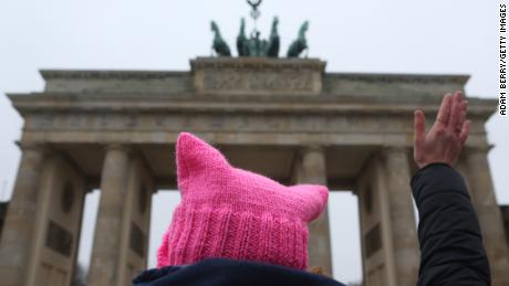 An activist with a &quot;pink pussy hat&quot; participates in front of the Brandenburg Gate in a demonstration for women&#39;s rights on January 21, 2018, in Berlin, Germany. 