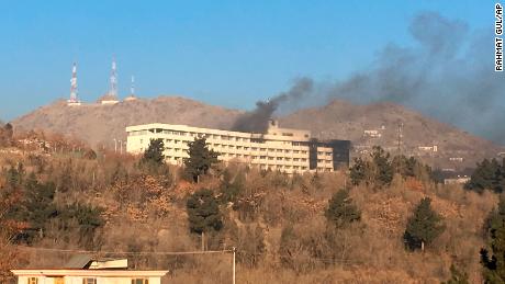 Smokes rises from the Intercontinental Hotel after an attack in Kabul, Afghanistan, Sunday, Jan. 21, 2018. Gunmen stormed the hotel in the Afghan capital on Saturday evening, triggering a shootout with security forces, officials said. (AP Photo/Rahmat Gul)