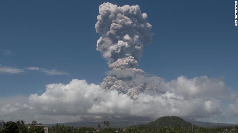 A huge column of ash shoots up to the sky during the eruption of Mayon volcano Monday, Jan. 22, 2018.