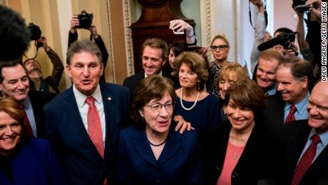 Senators Joe Manchin (D-WV) and Susan Collins (R-ME) lead a group of bipartisan Senators as they speak to reporters after the Senate passed a procedural vote for a continuing resolution to fund the federal government on Monday. (Photo by Drew Angerer/Getty Images)