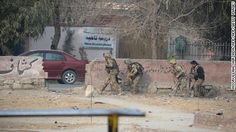 Afghan army soldiers take positions near the global charity&#39;s office Wednesday. 