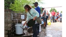 People queue to collect water from a natural spring in Cape Town, South Africa, Monday, Jan 22, 2018 as the city suffers from one of the worst droughts in recent history. Officials are looking to combat the drought, saying it was looking more likely that it will have to turn off most taps on &quot;Day Zero,&quot; or April 21 stating that 60 percent of residents are &quot;callously&quot; using more than the current limit and that the city will fine households that use too much water. (AP Photo/Anwa Essop)