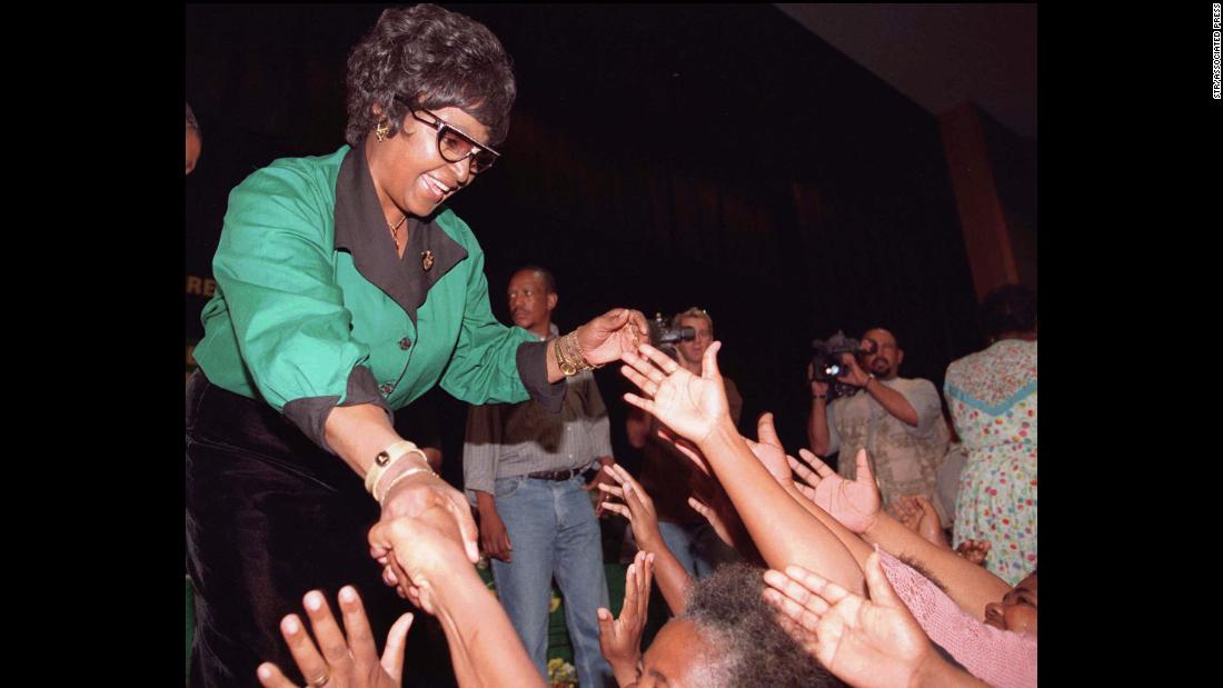 Madikizela-Mandela shakes hands with supporters in Rustenburg, South Africa, in 1997. She had just been elected president of the African National Congress Women&#39;s League.