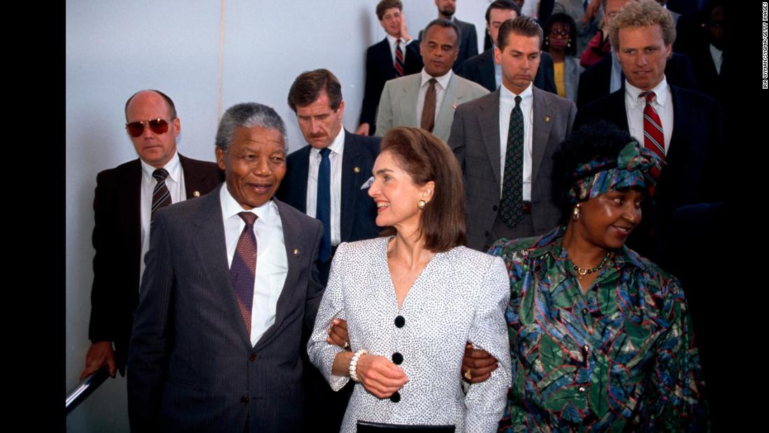 The Mandelas are welcomed by former first lady Jackie Kennedy during a visit to Boston in 1990.