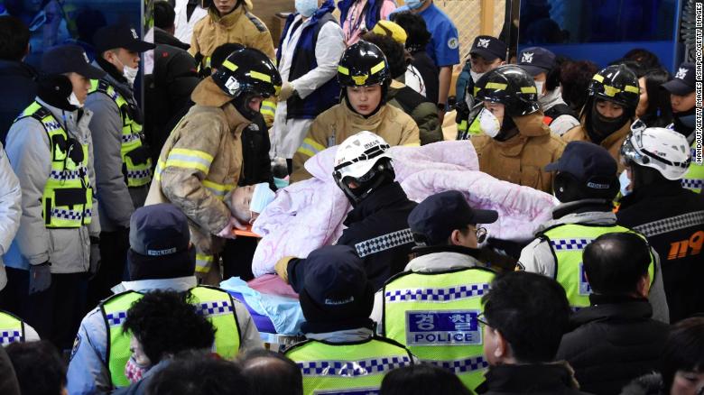 Rescue workers remove a survivor from a hospital fire on January 26, 2018 in Miryang, South Korea. 
