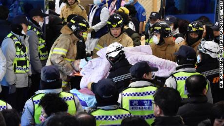 Rescue workers remove a survivor from a hospital fire on January 26, 2018 in Miryang, South Korea. 