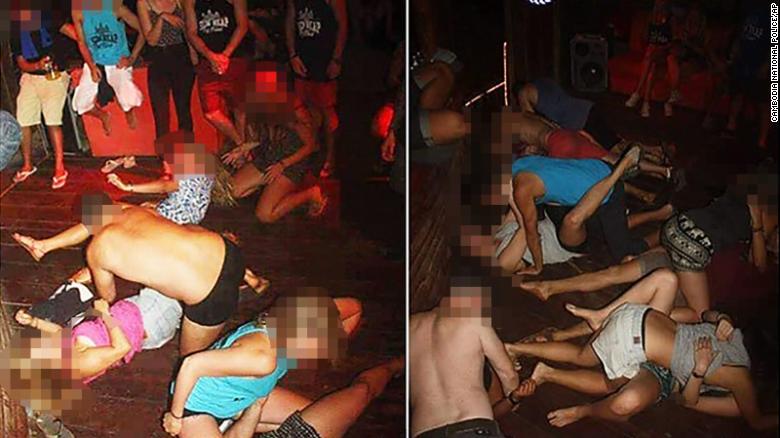A group of unidentified foreigners, who are accused of &quot;dancing pornographically&quot; at a party in Siem Reap town, in a photo issued by Cambodian police from January 25. CNN has blurred the faces of the people in this photograph for their privacy.