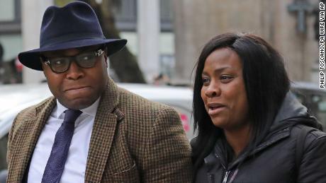 The parents of baby Isaiah Haastrup, Lanre Haastrup, left, and Takesha Thomas outside the High Court in London at an earlier hearing.