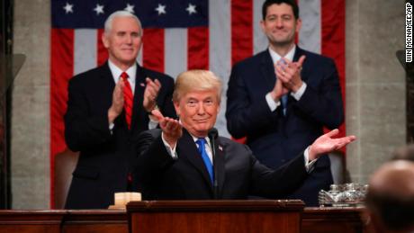 President Donald Trump gestures as delivers his first State of the Union address in the House chamber of the U.S. Capitol to a joint session of Congress Tuesday, Jan. 30, 2018 in Washington, as Vice President Mike Pence and House Speaker Paul Ryan applaud. (Win McNamee/Pool via AP)