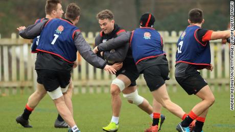 Ben Earli carries the ball into the tackle in training