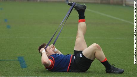 Joe Heyes stretches before training