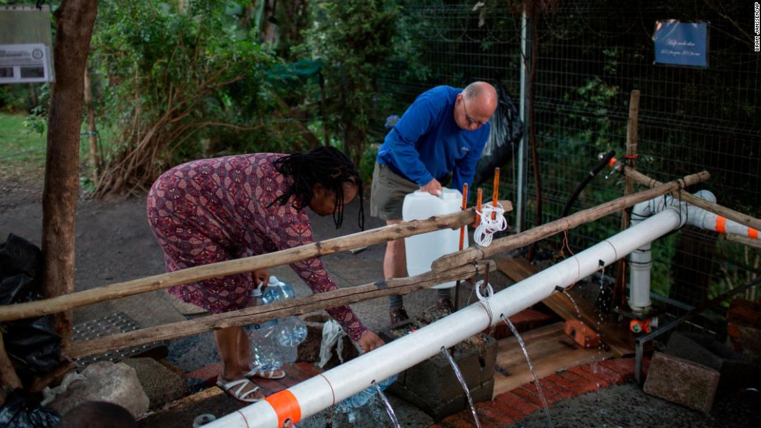 People collect water on February 1.