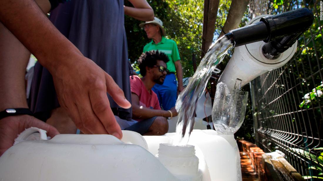 Cape Town residents fill water containers on February 1.