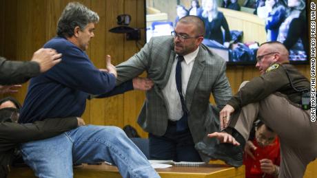 Father lunges at Larry Nassar in court before being restrained