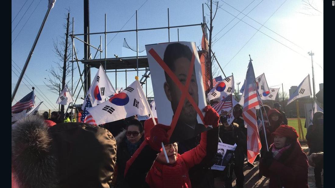 Anti-North Korea protesters gather outside Seonhak International Ice Rink ahead of Korea's friendly against Sweden.