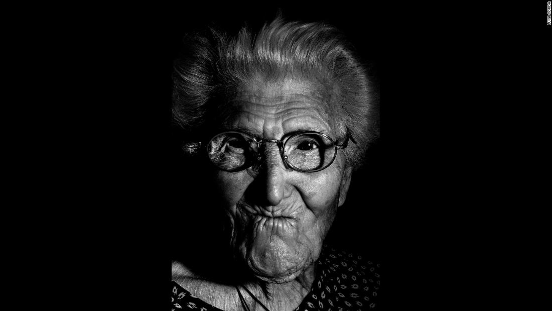 Maria Bonaria Argiolas, born in 1909, prays every day and enjoys watching the news on TV.