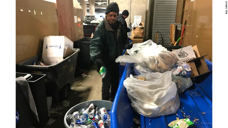 Workers sort waste at US Bank Stadium.