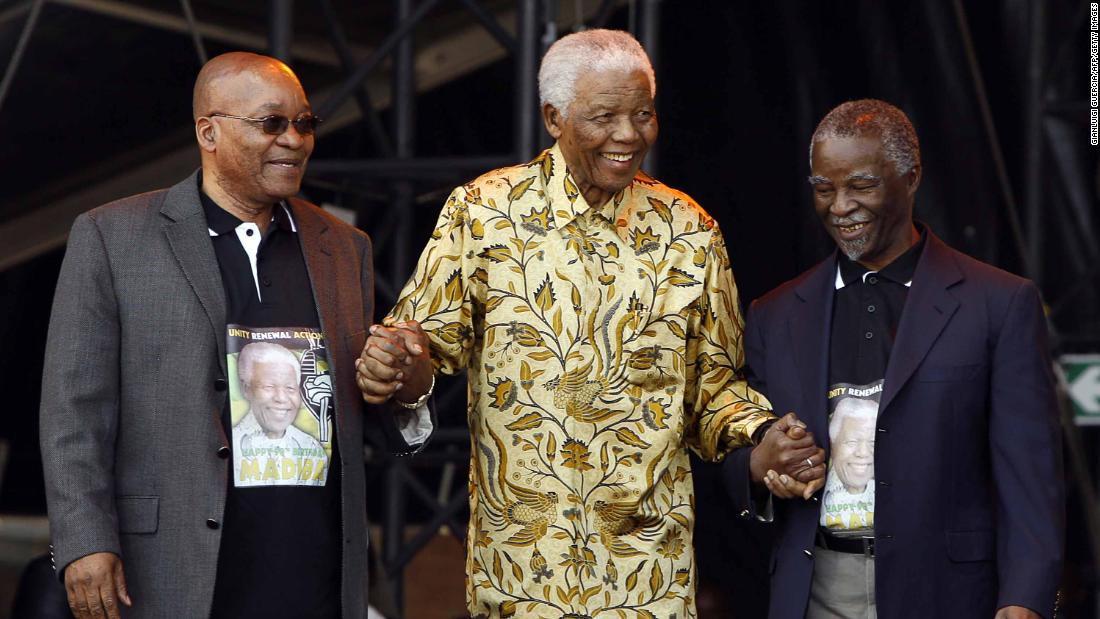 From left, Zuma, Mandela and Mbeki arrive on stage for Mandela&#39;s 90th birthday celebration in August 2008.