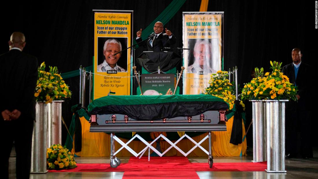 Zuma sings during a send-off ceremony for former President Nelson Mandela, who died in December 2013 at the age of 95.