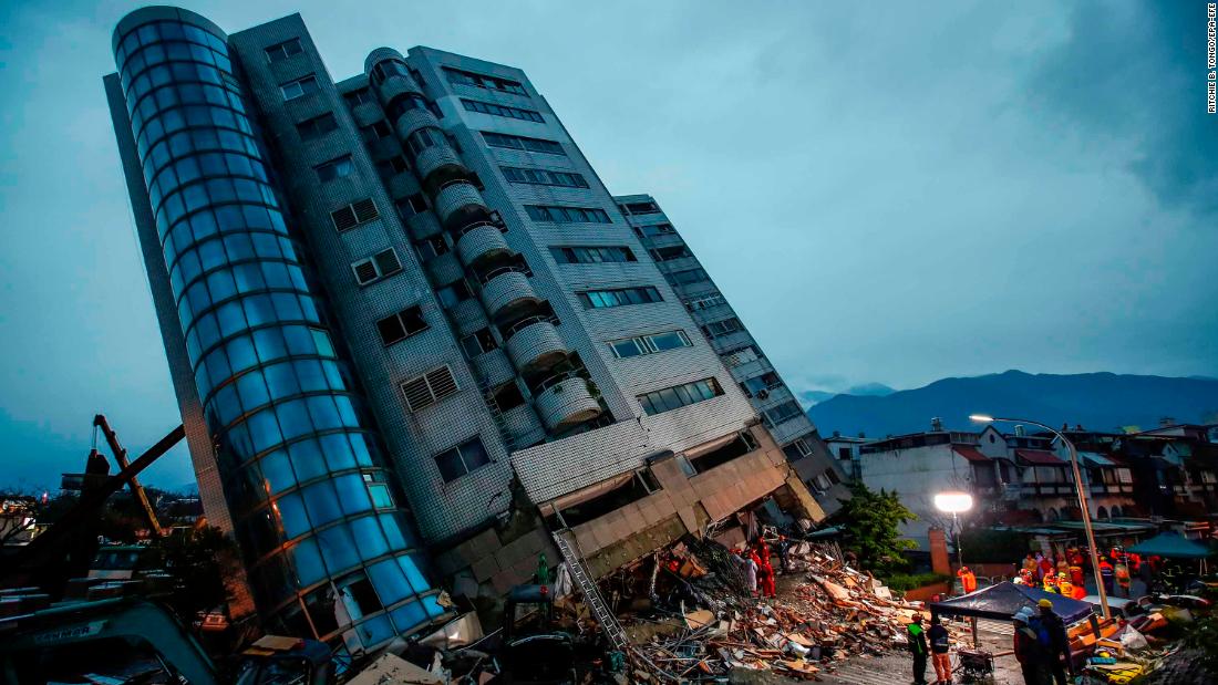Rescue services search for people at a damaged building in Hualien, Taiwan, on Wednesday, February 7. A 6.4 magnitude earthquake was recorded about 21 kilometers (13 miles) north of Hualien late Tuesday. Several people were killed and many were injured.