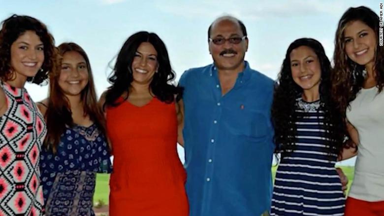 A family photo of Amer Adi with his wife and daughters. 