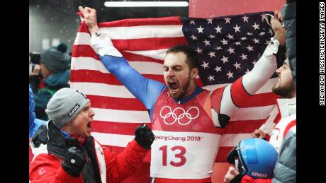 Chris Mazdzer of the United States celebrates after winning the silver medal following run 4 during the luge men&#39;s singles. 