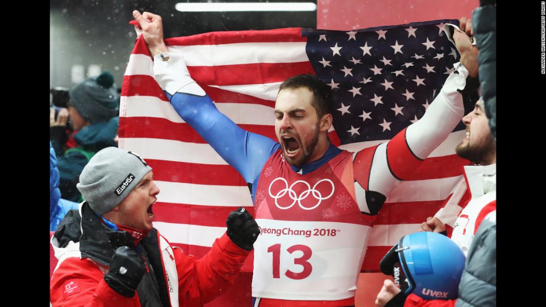 Silver medalist Chris Mazdzer celebrates after capturing the first-ever men&#39;s singles luge medal for the United States.