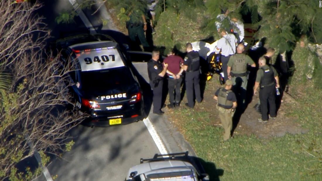 The suspect, 19-year-old former student Nikolas Cruz, is taken into custody by authorities. Cruz was apprehended off of the campus.