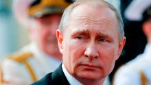 Russian President Vladimir Putin looks on as he attends a ceremony for Russia's Navy Day in Saint Petersburg on July 30, 2017.
President Vladimir Putin oversaw a pomp-filled display of Russia's naval might as the Kremlin paraded its sea power from the Baltic Sea to the shores of Syria.  Some 50 warships and submarines were on show along the Neva River and in the Gulf of Finland off the country's second city of Saint Petersburg after Putin ordered the navy to hold its first ever parade on such a grand scale.  / AFP PHOTO / POOL / Alexander Zemlianichenko        (Photo credit should read ALEXANDER ZEMLIANICHENKO/AFP/Getty Images)