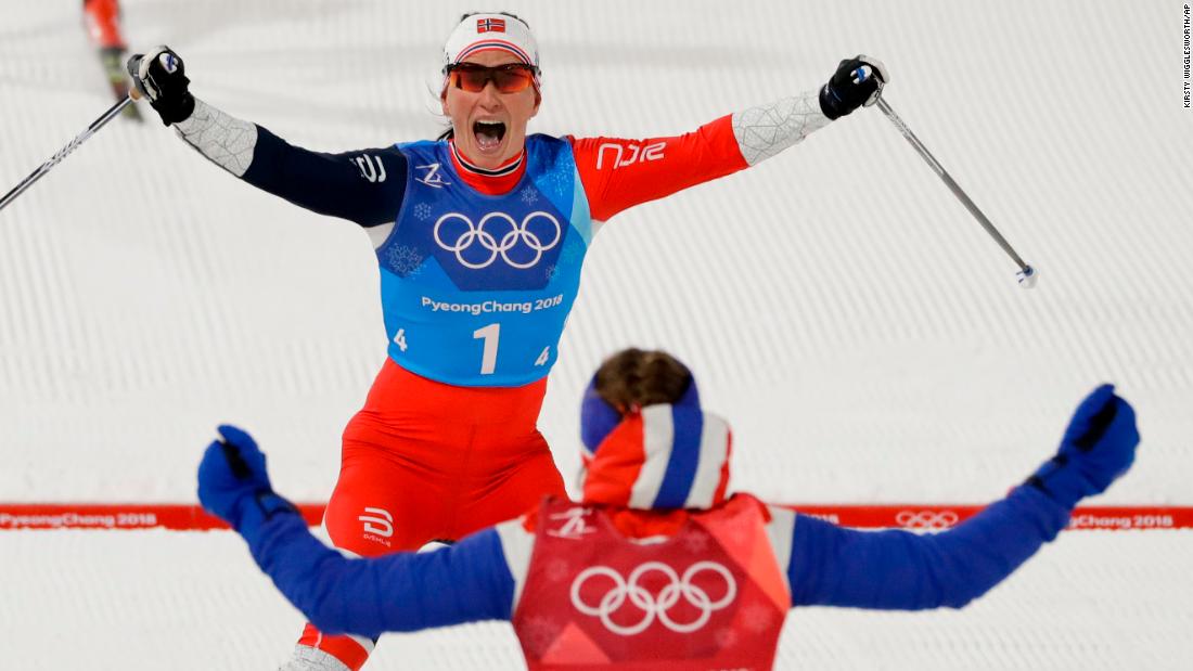 Marit Bjørgen, top, celebrates with Ingvild Flugstad Østberg after Norway won a cross-country relay. With the victory, Bjørgen became the most decorated Winter Olympian ever. She now has 13 Olympic medals, tying her with Norwegian biathlete Ole Einar Bjørndalen.
