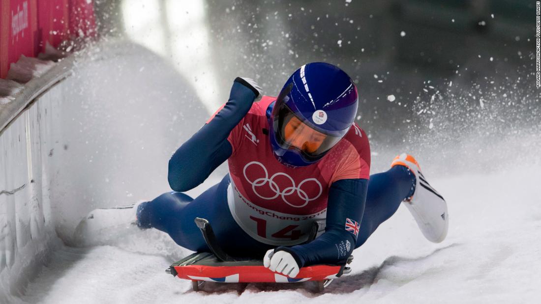 Great Britain&#39;s Lizzy Yarnold celebrates at the finish line in the women&#39;s skeleton event. She won the gold medal.