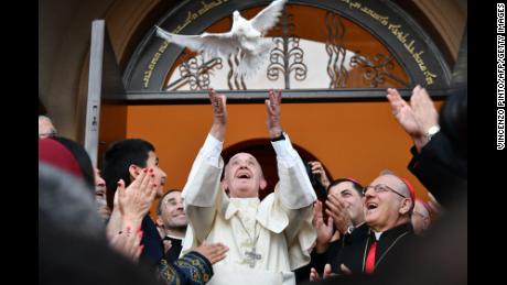 TOPSHOT - Pope Francis (C) releases a dove as a symbol of peace during a meeting with Chaldean community at the Catholic Church of St Simon Bar Sabbae in Tbilisi, on September 30, 2016.Pope Francis set off on September 30 for Georgia and Azerbaijan on what Vatican officials billed as a mission to promote peace in a troubled part of the world, three months after he visited neighbouring Armenia. / AFP / VINCENZO PINTO        (Photo credit should read VINCENZO PINTO/AFP/Getty Images)