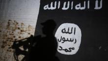 TOPSHOT - A member of the Iraqi forces walks past a mural bearing the logo of the Islamic State (IS) group in a tunnel that was reportedly used as a training centre by the jihadists, on March 1, 2017, in the village of Albu Sayf, on the southern outskirts of Mosul.
Iraqi forces launched a major push on February 19 to recapture the west of Mosul from the Islamic State jihadist group, retaking the airport and then advancing north. / AFP PHOTO / AHMAD AL-RUBAYE        (Photo credit should read AHMAD AL-RUBAYE/AFP/Getty Images)